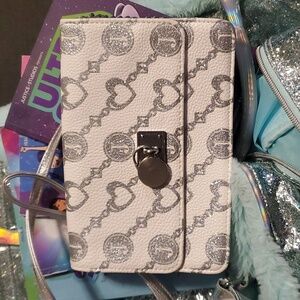 Justice suitcase, purse and books